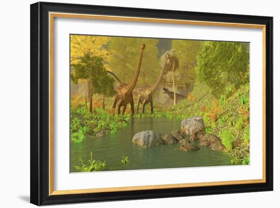 A Ceratosaurus Tries to Sneak Up Behind Two Diplodocus Dinosaurs-Stocktrek Images-Framed Art Print