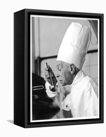 A Chef in a Chef's Hat Tastes Some Soup or Other Food from a Ladle-null-Framed Premier Image Canvas