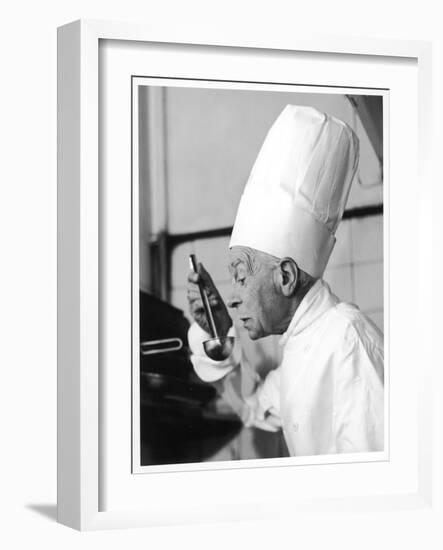 A Chef in a Chef's Hat Tastes Some Soup or Other Food from a Ladle-null-Framed Photographic Print