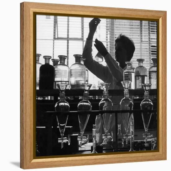 A Chemist at Work in Her Laboratory-Henry Grant-Framed Premier Image Canvas