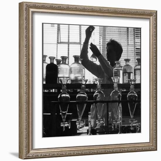 A Chemist at Work in Her Laboratory-Henry Grant-Framed Photographic Print