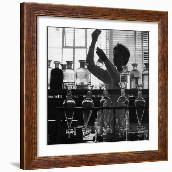 A Chemist at Work in Her Laboratory-Henry Grant-Framed Photographic Print