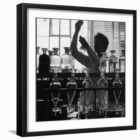 A Chemist at Work in Her Laboratory-Henry Grant-Framed Photographic Print