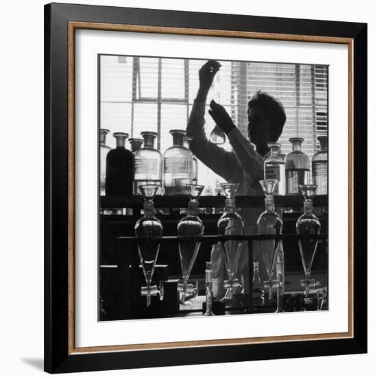 A Chemist at Work in Her Laboratory-Henry Grant-Framed Photographic Print