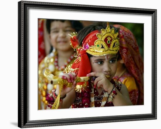 A Child Enacts the Life of Hindu God Krishna During Janamashtami Celebrations-null-Framed Photographic Print