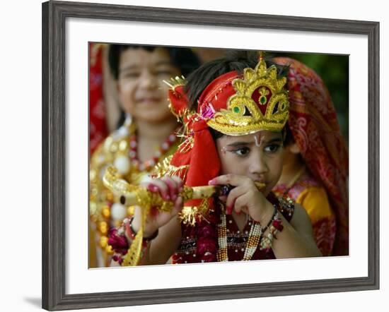 A Child Enacts the Life of Hindu God Krishna During Janamashtami Celebrations-null-Framed Photographic Print