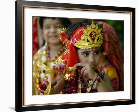 A Child Enacts the Life of Hindu God Krishna During Janamashtami Celebrations-null-Framed Photographic Print