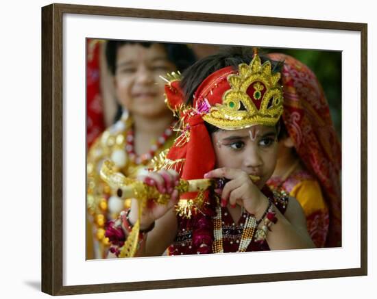 A Child Enacts the Life of Hindu God Krishna During Janamashtami Celebrations-null-Framed Photographic Print