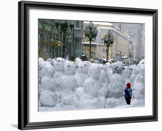 A Child Plays Among the Snowmen Made at the Arbat-null-Framed Photographic Print