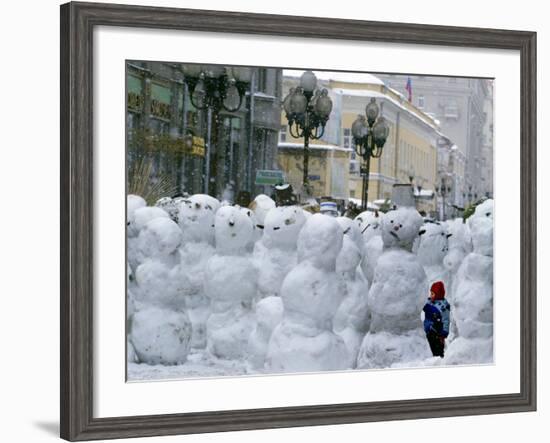 A Child Plays Among the Snowmen Made at the Arbat-null-Framed Photographic Print