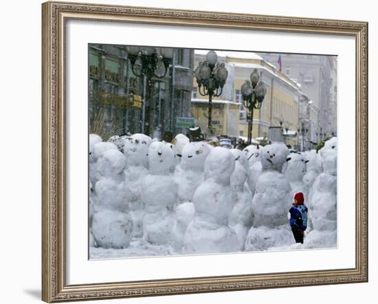 A Child Plays Among the Snowmen Made at the Arbat-null-Framed Photographic Print