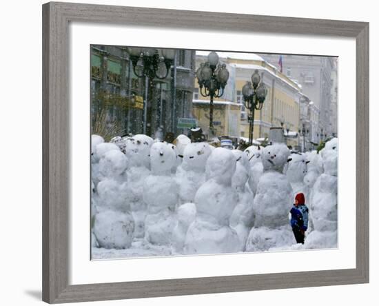 A Child Plays Among the Snowmen Made at the Arbat-null-Framed Photographic Print