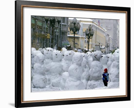 A Child Plays Among the Snowmen Made at the Arbat-null-Framed Photographic Print