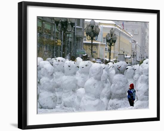 A Child Plays Among the Snowmen Made at the Arbat-null-Framed Photographic Print