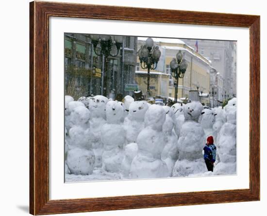 A Child Plays Among the Snowmen Made at the Arbat-null-Framed Photographic Print