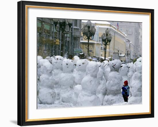 A Child Plays Among the Snowmen Made at the Arbat-null-Framed Photographic Print