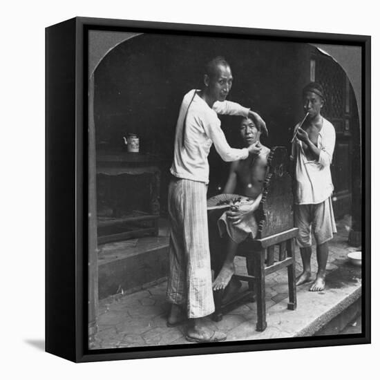 A Chinese Barber at Bhamo, Burma, 1908-null-Framed Premier Image Canvas