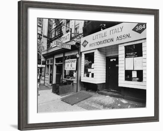 A Chinese Laundromat is Seen Next Door to the Offices of the Little Italy Restoration Association-null-Framed Photographic Print