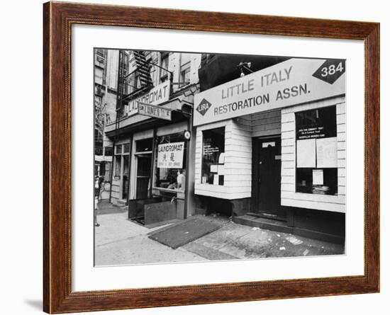 A Chinese Laundromat is Seen Next Door to the Offices of the Little Italy Restoration Association-null-Framed Photographic Print