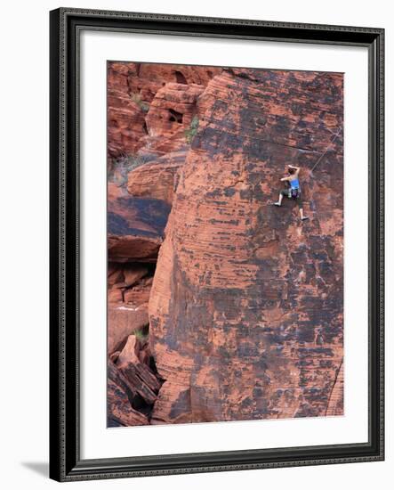 A Climber Ascends a Rock Face-null-Framed Photographic Print