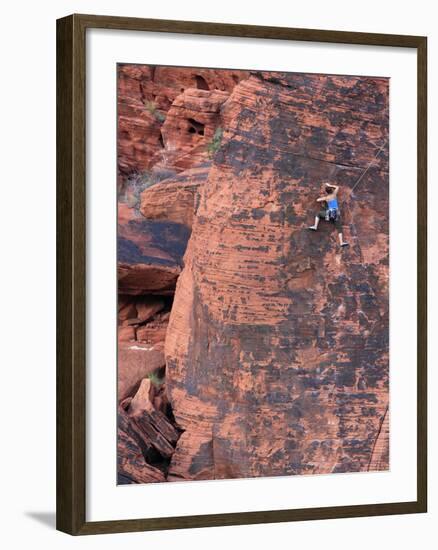 A Climber Ascends a Rock Face-null-Framed Photographic Print