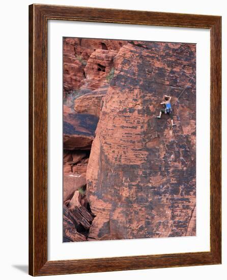 A Climber Ascends a Rock Face-null-Framed Photographic Print