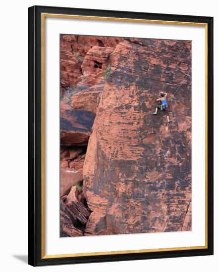 A Climber Ascends a Rock Face-null-Framed Photographic Print