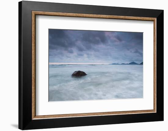 A cloudy but dramatic sunset on Itamambuca beach, Sao Paulo, Brazil.-Alex Saberi-Framed Photographic Print