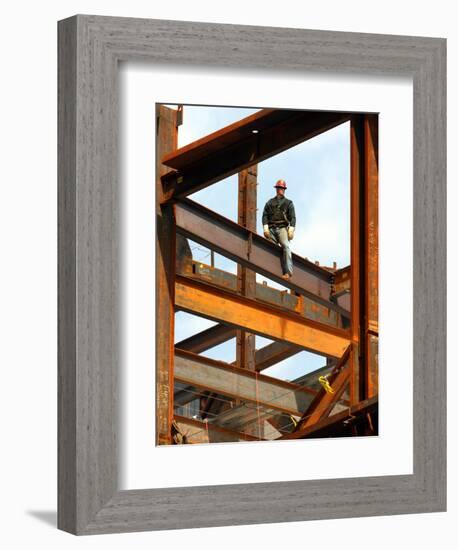 A Construction Worker Stands on a Steel Beam While Working on a High Rise Building-null-Framed Premium Photographic Print