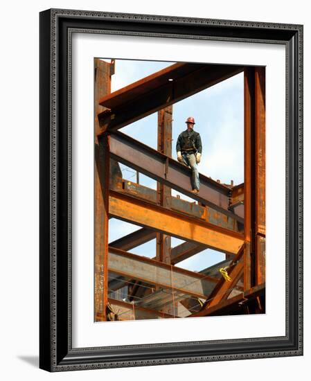 A Construction Worker Stands on a Steel Beam While Working on a High Rise Building-null-Framed Photographic Print