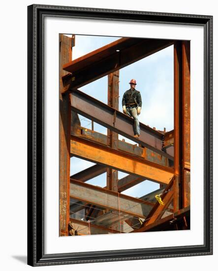 A Construction Worker Stands on a Steel Beam While Working on a High Rise Building-null-Framed Photographic Print