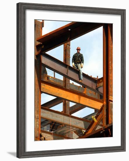 A Construction Worker Stands on a Steel Beam While Working on a High Rise Building-null-Framed Photographic Print