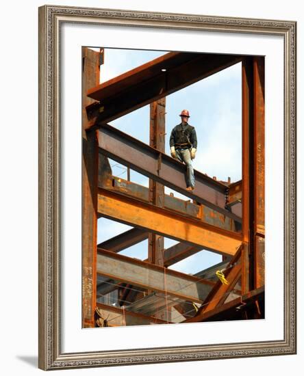 A Construction Worker Stands on a Steel Beam While Working on a High Rise Building-null-Framed Photographic Print