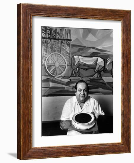 A Cook Holds a Bowl of Cuban Style Black Beans at La Carreta Restaurant, 1987-null-Framed Photographic Print