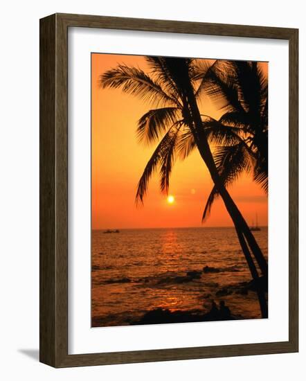 A Couple in Silhouette, Enjoying a Romantic Sunset Beneath the Palm Trees in Kailua-Kona, Hawaii-Ann Cecil-Framed Photographic Print