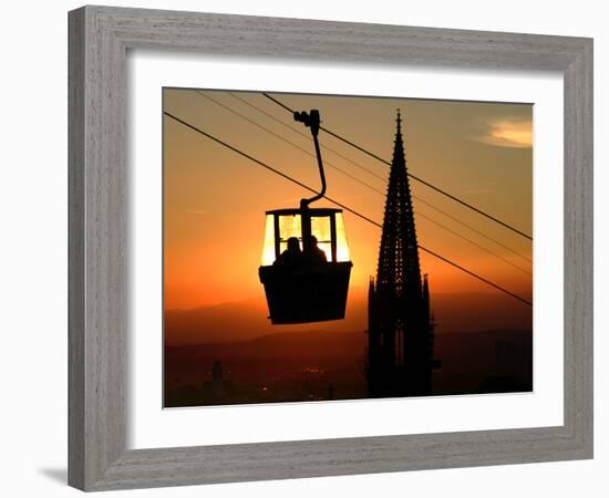 A Couple Sit in a Gondola in Freiburg, Southwestern Germany-null-Framed Photographic Print