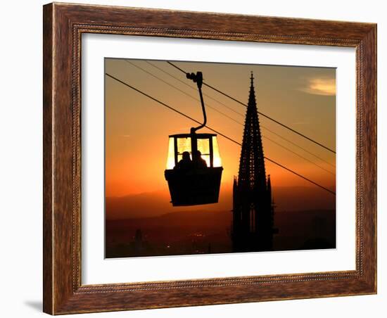 A Couple Sit in a Gondola in Freiburg, Southwestern Germany-null-Framed Photographic Print