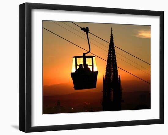 A Couple Sit in a Gondola in Freiburg, Southwestern Germany-null-Framed Photographic Print