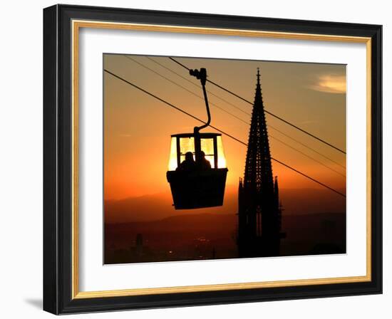 A Couple Sit in a Gondola in Freiburg, Southwestern Germany-null-Framed Photographic Print