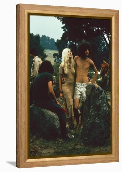 A Couple Stand Together at the Woodstock Music and Arts Fair, Bethel, New York, August 1969-John Dominis-Framed Premier Image Canvas