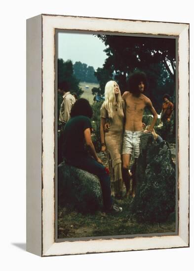 A Couple Stand Together at the Woodstock Music and Arts Fair, Bethel, New York, August 1969-John Dominis-Framed Premier Image Canvas