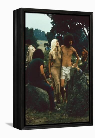 A Couple Stand Together at the Woodstock Music and Arts Fair, Bethel, New York, August 1969-John Dominis-Framed Premier Image Canvas