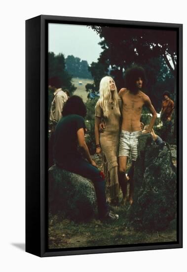 A Couple Stand Together at the Woodstock Music and Arts Fair, Bethel, New York, August 1969-John Dominis-Framed Premier Image Canvas