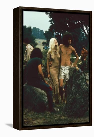 A Couple Stand Together at the Woodstock Music and Arts Fair, Bethel, New York, August 1969-John Dominis-Framed Premier Image Canvas