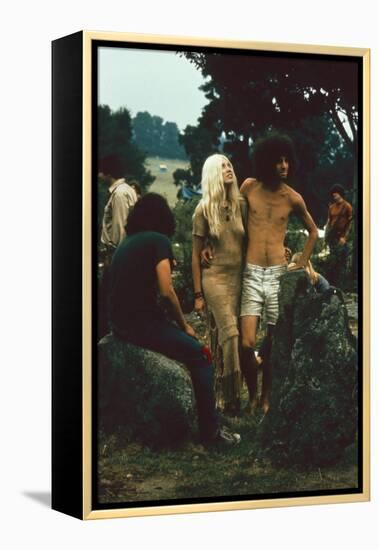 A Couple Stand Together at the Woodstock Music and Arts Fair, Bethel, New York, August 1969-John Dominis-Framed Premier Image Canvas