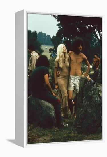 A Couple Stand Together at the Woodstock Music and Arts Fair, Bethel, New York, August 1969-John Dominis-Framed Premier Image Canvas