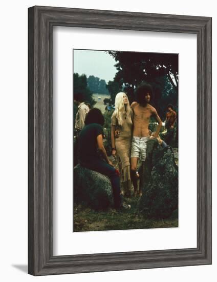 A Couple Stand Together at the Woodstock Music and Arts Fair, Bethel, New York, August 1969-John Dominis-Framed Photographic Print