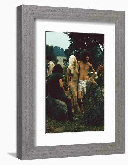 A Couple Stand Together at the Woodstock Music and Arts Fair, Bethel, New York, August 1969-John Dominis-Framed Photographic Print