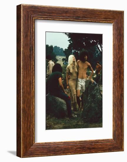 A Couple Stand Together at the Woodstock Music and Arts Fair, Bethel, New York, August 1969-John Dominis-Framed Photographic Print