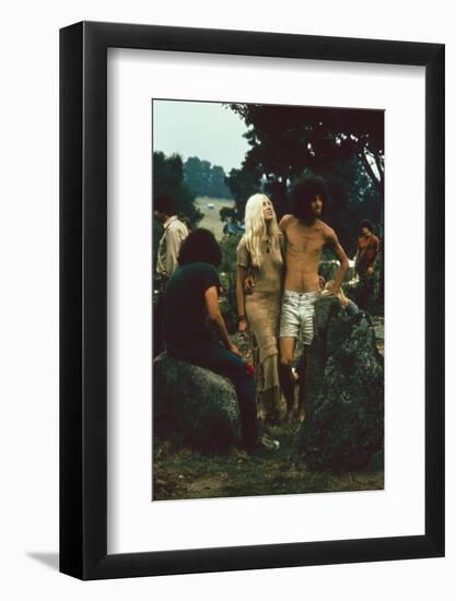 A Couple Stand Together at the Woodstock Music and Arts Fair, Bethel, New York, August 1969-John Dominis-Framed Photographic Print